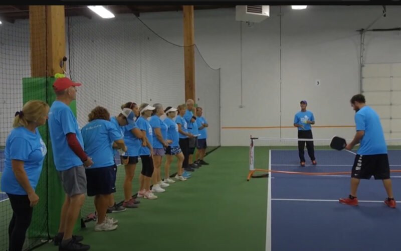 Group of diverse players at a pickleball clinic and workshop