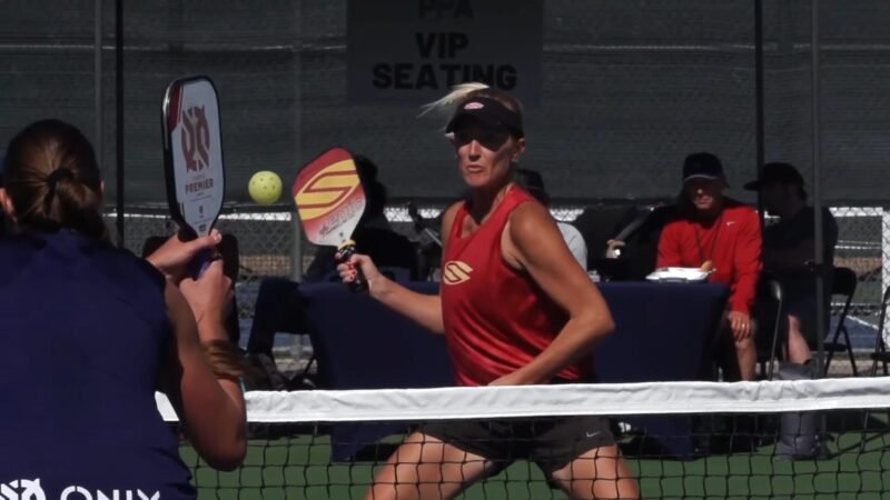 women's pickleball single match paddle in hands